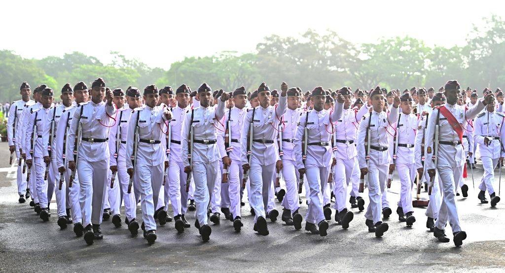 NDA cadets in white uniform parade
